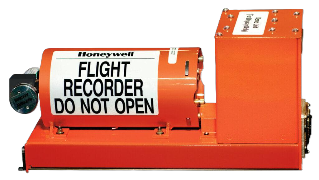An orange aircraft flight recorder stencilled “FLIGHT RECORDER DO NOT OPEN”.